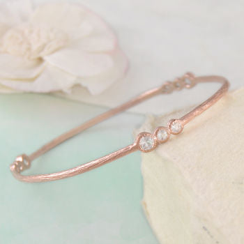 
            
                Load image into Gallery viewer, White Topaz Rose Gold November Birthstone Bangle
            
        