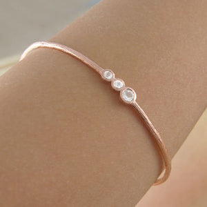 
            
                Load image into Gallery viewer, White Topaz Rose Gold November Birthstone Bangle
            
        