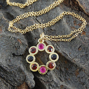 
            
                Load image into Gallery viewer, Gold Garnet And Ruby Flower Birthstone Necklace
            
        
