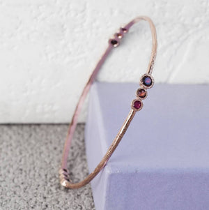 
            
                Load image into Gallery viewer, Silver Garnet And Ruby Triple Stone Bangle
            
        